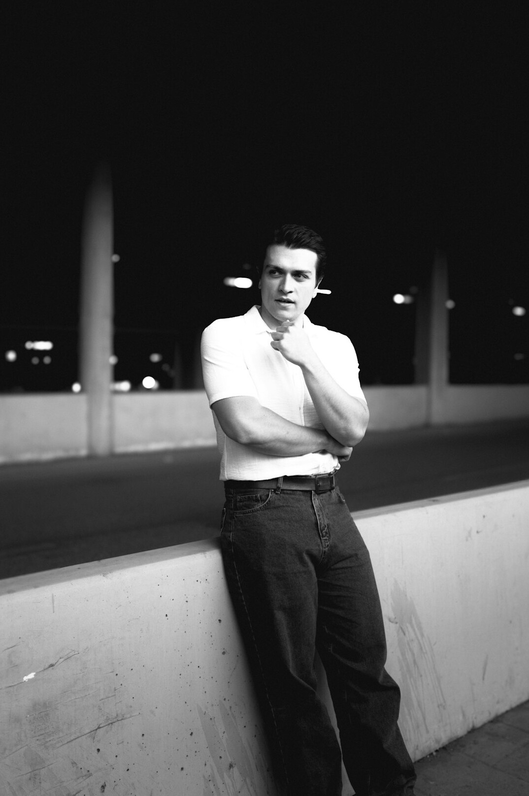 Portrait of a man in his forties with short dark hair and a light shirt